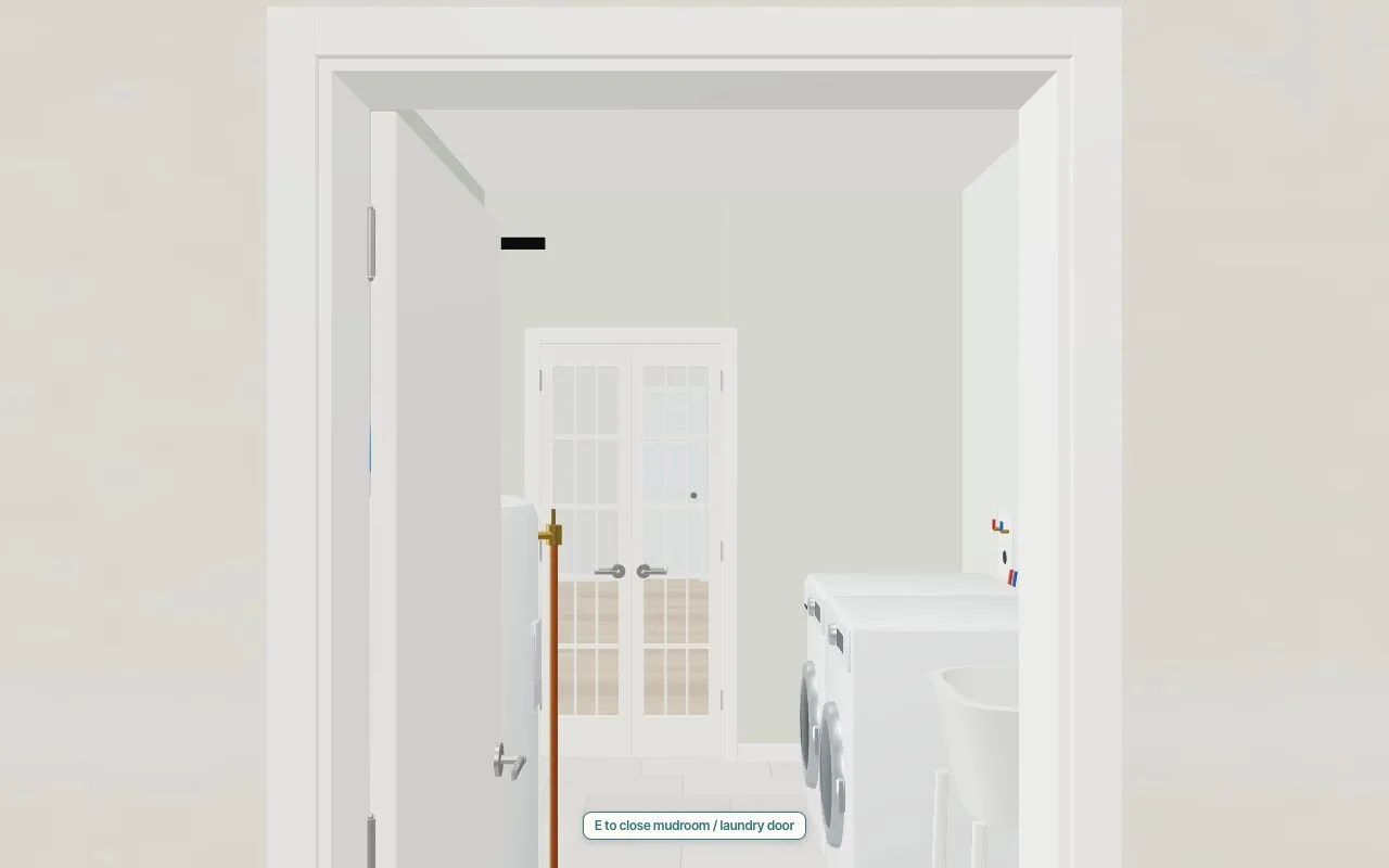 Through an open door into the mudroom: French doors beyond, the washer and the trim at every opening