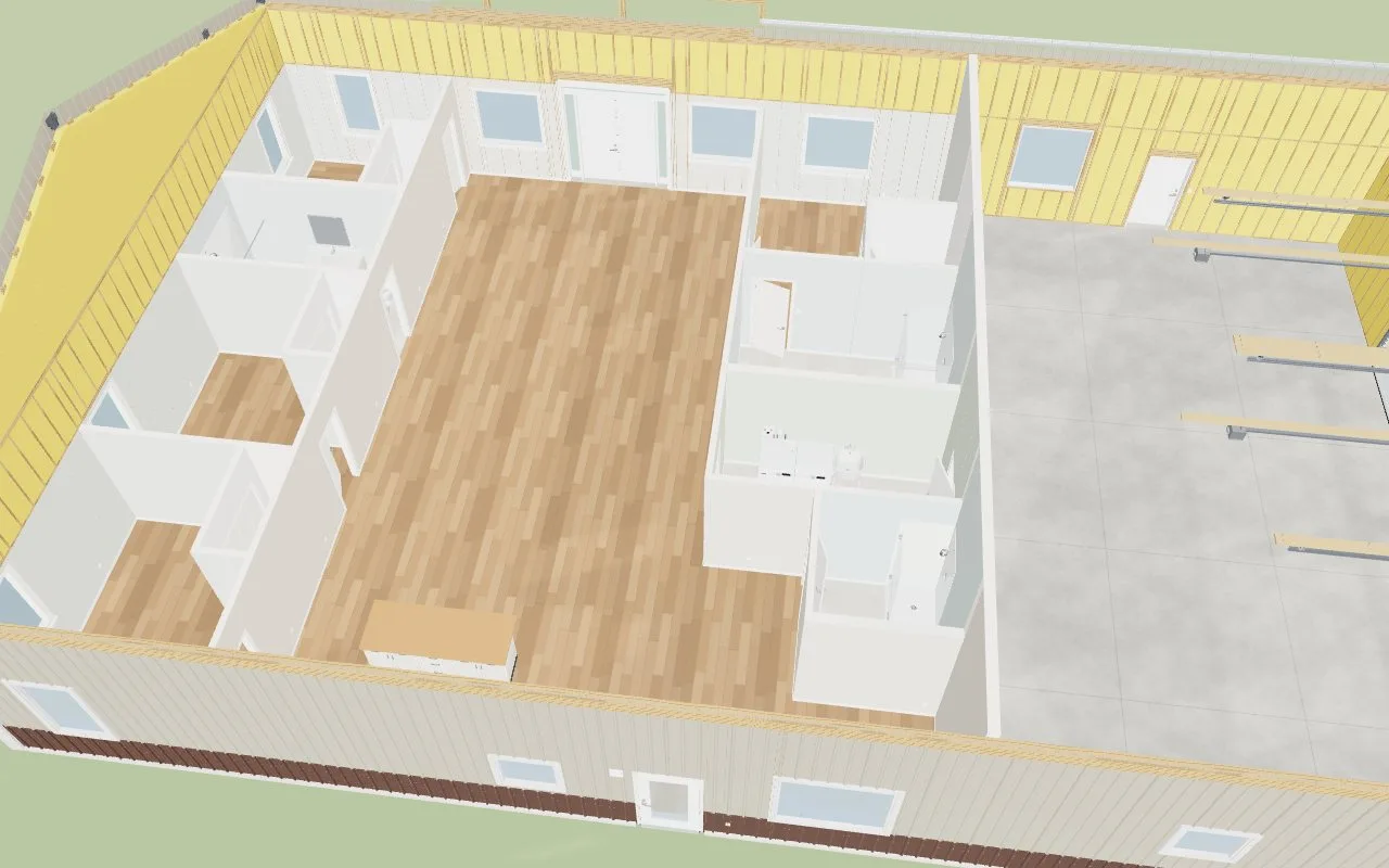 The house with the roof off: LVP through the living space, tile in the baths and laundry, sealed concrete in the shop, every room its own wall colour