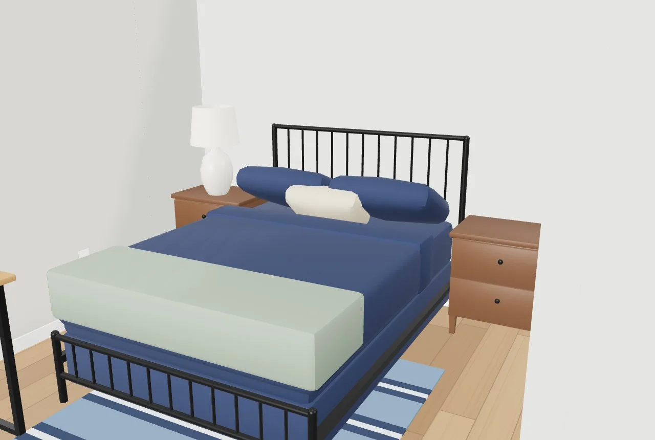 A second bedroom with a metal bed, navy bedding, a striped rug and wood nightstands